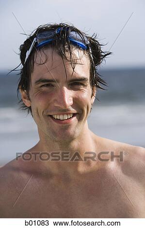 Portrait of a young man on the beach View Large Photo Image Stock Image - Portrait of a young man on the beach. Fotosearch