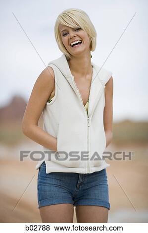 Portrait of a young woman smiling View Large Photo Image Stock Photo - Portrait of a young woman smiling. Fotosearch