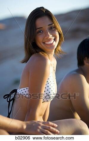 Portrait of a young woman smiling View Large Photo Image Stock Photograph - Portrait of a young woman smiling. Fotosearch