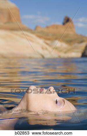 Profile of a young woman in a lake View Large Photo Image Stock Image - Profile of a young woman in a lake. Fotosearch