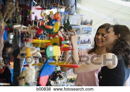 Stock Photo - Profile of two teenage girls shopping. Fotosearch
