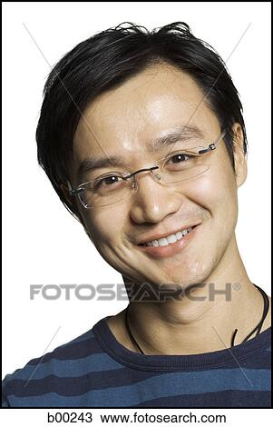 Portrait of a young man smiling View Large Photo Image Stock Image - Portrait of a young man smiling. Fotosearch
