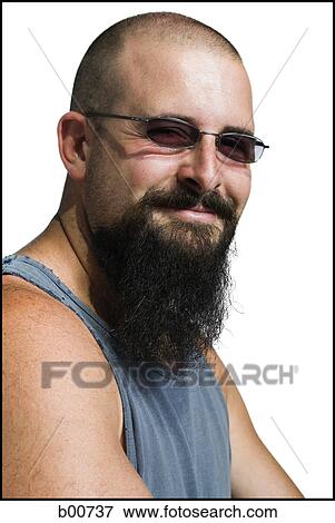 Portrait of a young man wearing sunglasses smiling View Large Photo Image Stock Photo - Portrait of a young man wearing sunglasses smiling. Fotosearch