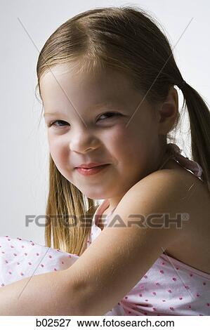 Stock Photo - Close-up of a girl smiling. Fotosearch