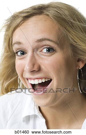 Close-up of a young woman smiling View Large Photo Image Stock Image - Close-up of a young woman smiling. Fotosearch