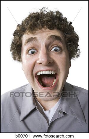 Portrait of a young man making a face View Large Photo Image Stock Image - Portrait of a young man making a face. Fotosearch
