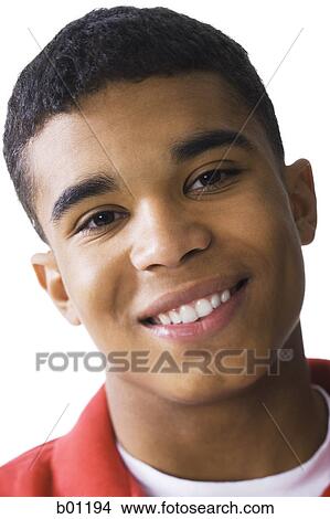 Portrait of a young man smiling View Large Photo Image Picture - Portrait of a young man smiling. Fotosearch