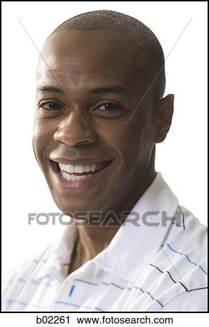 Stock Image - Portrait of a young man smiling. Fotosearch