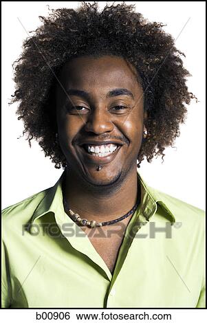 Portrait of a young man smiling View Large Photo Image Stock Photograph - Portrait of a young man smiling. Fotosearch