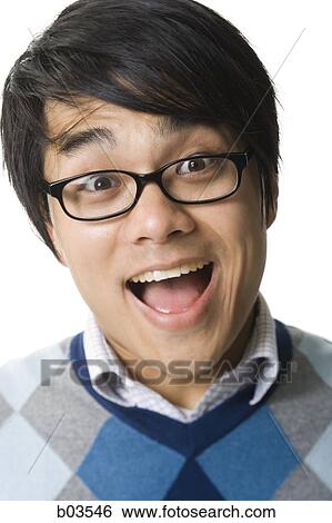 Portrait of a young man smiling View Large Photo Image Stock Photograph - Portrait of a young man smiling. Fotosearch