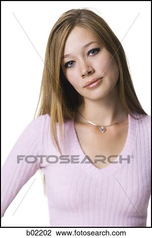 Stock Image - Portrait of a young woman posing. Fotosearch