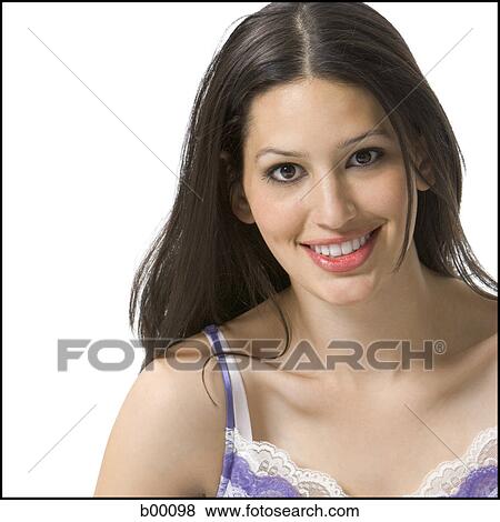 Portrait of a young woman smiling View Large Photo Image Stock Photo - Portrait of a young woman smiling. Fotosearch