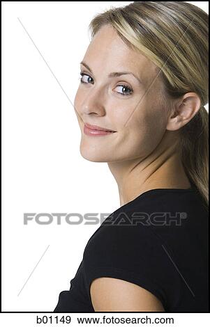 Stock Photo - Portrait of a young woman smiling. Fotosearch