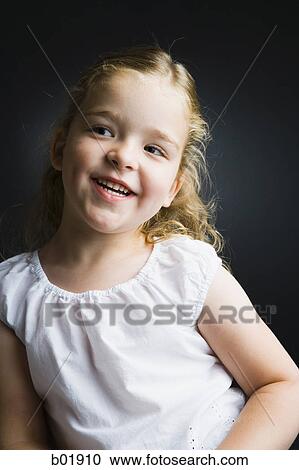 Close-up of a girl smiling View Large Photo Image Stock Image - Close-up of a girl smiling. Fotosearch