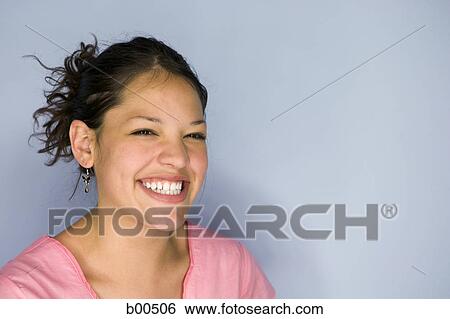 Close-up of a teenage girl smiling View Large Photo Image Stock Photograph - Close-up of a teenage girl smiling. Fotosearch