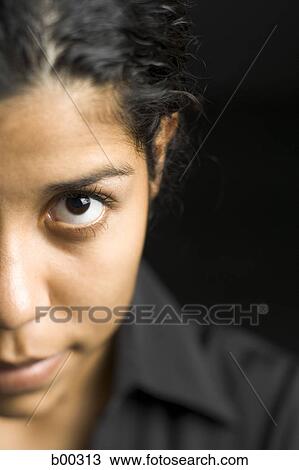 Stock Image - Close-up of a young woman staring. Fotosearch