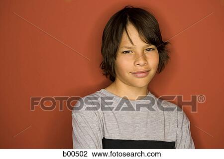 Stock Image - Portrait of a boy grinning. Fotosearch