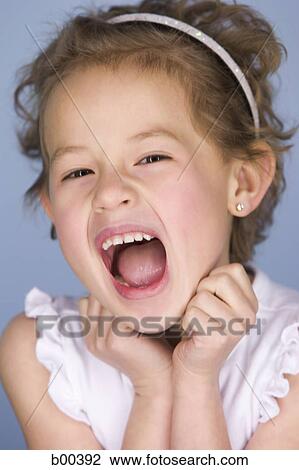 Stock Image - Portrait of a girl screaming. Fotosearch