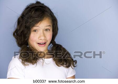 Stock Photo - Portrait of a girl smiling. Fotosearch