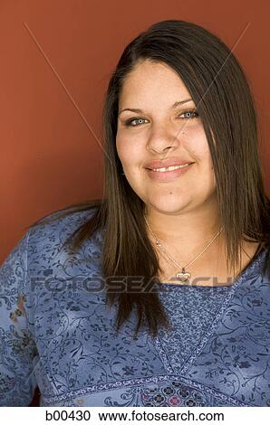 Portrait of a teenage girl smiling View Large Photo Image Stock Image - Portrait of a teenage girl smiling. Fotosearch