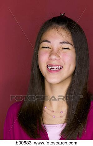 Portrait of a teenage girl smiling View Large Photo Image Stock Image - Portrait of a teenage girl smiling. Fotosearch