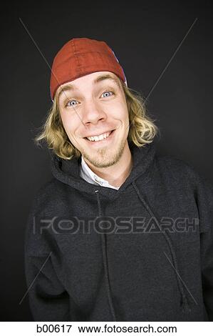 Portrait of a young man smiling View Large Photo Image Stock Photo - Portrait of a young man smiling. Fotosearch