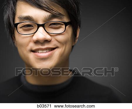 Stock Image - Portrait of a young woman jumping. Fotosearch