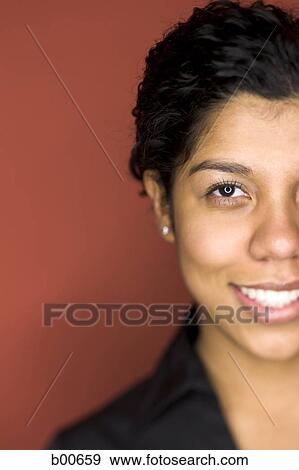 Portrait of a young woman smiling View Large Photo Image Stock Photo - Portrait of a young woman smiling. Fotosearch