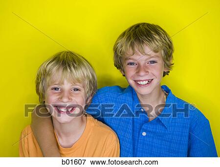 Stock Photo - Portrait of two boys smiling. Fotosearch