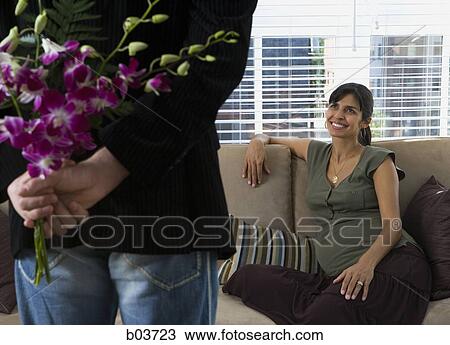 High angle view of a young woman lying down on a field View Large Photo Image Stock Image - High angle view of a young woman lying down on a field. Fotosearch
