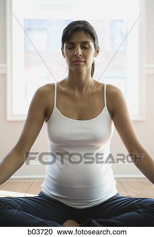 Young woman biting a piece of a watermelon View Large Photo Image Stock Image - Young woman biting a piece of a watermelon. Fotosearch