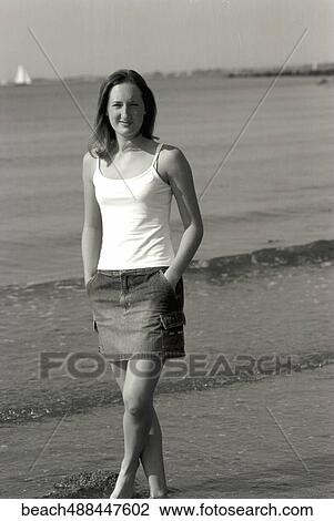 Stock Image - Beach, Woman, Summer, Sand, Water, Ocean. Fotosearch