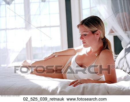 Stock Image - Bed, Woman, Bedroom, Home, Inside, 20 _ 35. Fotosearch