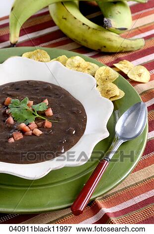 Black Bean Soup, Still Life, Food, Dinner, Plantains, Plantain Chips, Spoon View Large Photo Image Stock Photo - Black Bean Soup, Still Life, Food, Dinner, Plantains, Plantain Chips, Spoon. Fotosearch