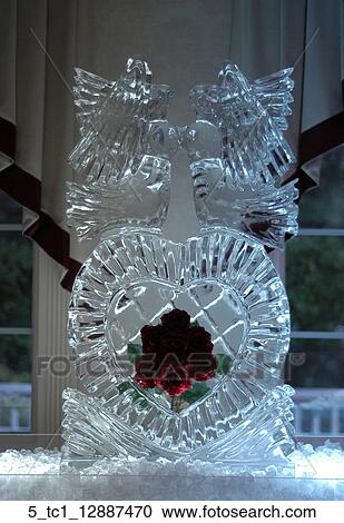 Stock Image - Bridal, Bride, Groom, Romantic, Wedding, Ice, Sculpture. Fotosearch
