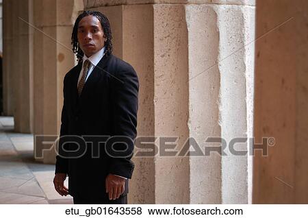 Stock Photo - Business, Portrait, Outside, African American, Suit, Pillar. Fotosearch