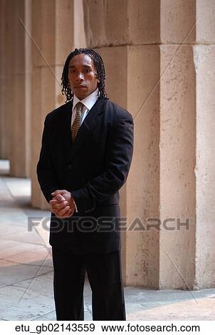 Stock Photo - Business, Portrait, Outside, African American, Suit, Pillar. Fotosearch