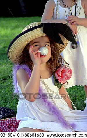 Stock Image - Child, Girl, Hat, Outside, Spring, Tea Party, Tea. Fotosearch