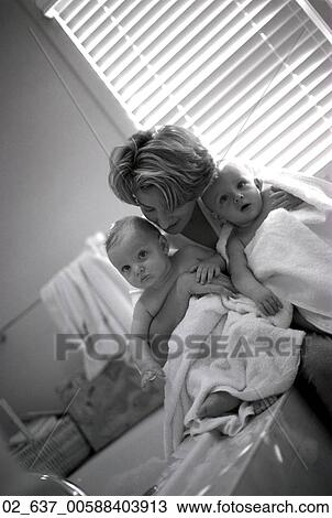 Stock Image - Child, Twins, Baby, Babies, Bath, Bathing, Mother. Fotosearch