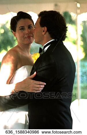 Stock Photograph - Couple, Bride Groom, Love, Wedding Day, Dancing, Tuxedo. Fotosearch