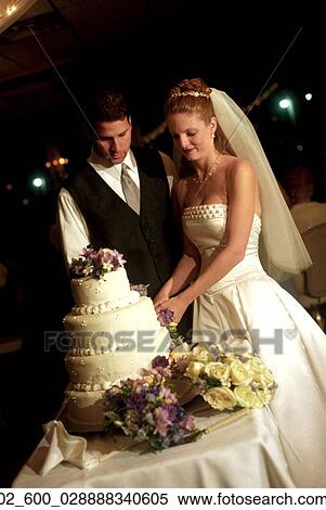 Couple, Bride, Groom, Wedding, Cake, Cutting, Flowers View Large Photo Image Stock Photography - Couple, Bride, Groom, Wedding, Cake, Cutting, Flowers. Fotosearch