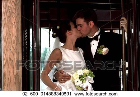 Couple, Wedding, Bride, Groom, Kiss, Bouquet, Threshold View Large Photo Image Stock Image - Couple, Wedding, Bride, Groom, Kiss, Bouquet, Threshold. Fotosearch