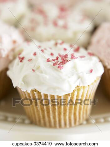 Cupcake, White, Icing, Red, Sprinkles, Jimmies View Large Photo Image Stock Photo - Cupcake, White, Icing, Red, Sprinkles, Jimmies. Fotosearch