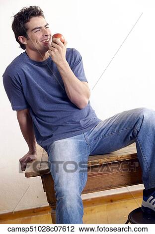 Stock Image - Eating, Relaxing, Inside. Fotosearch