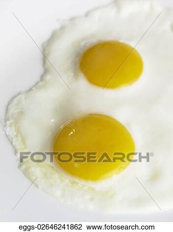 Stock Image - Eggs, Two, Cooked, Sunnyside, Breakfast, Fresh. Fotosearch