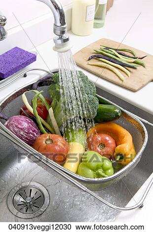 Stock Image - Food, Still Life, Kitchen, Healthy, Vegetables, Wash, Washing. Fotosearch