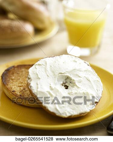 Food, Toasted, Bagel, Cream Cheese, Orange Juice, Plate, Yellow View Large Photo Image Stock Photo - Food, Toasted, Bagel, Cream Cheese, Orange Juice, Plate, Yellow. Fotosearch