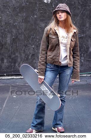 Stock Photograph - Outside, Woman, Winter, Portrait, Trendy. Fotosearch