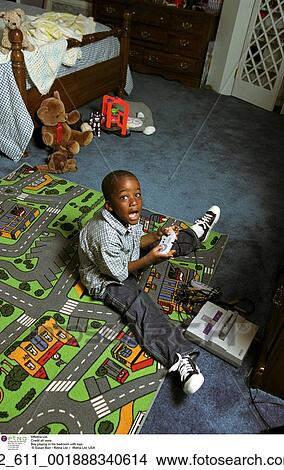 Picture - Playing, Bedroom, Child, Boy, Toys, Video Game, African American. Fotosearch