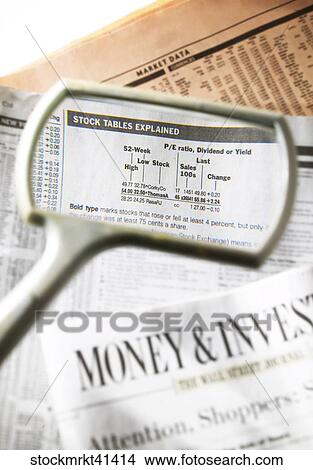 Picture - Still Life, Business, Finance, Newspaper, Magnifying Glass. Fotosearch